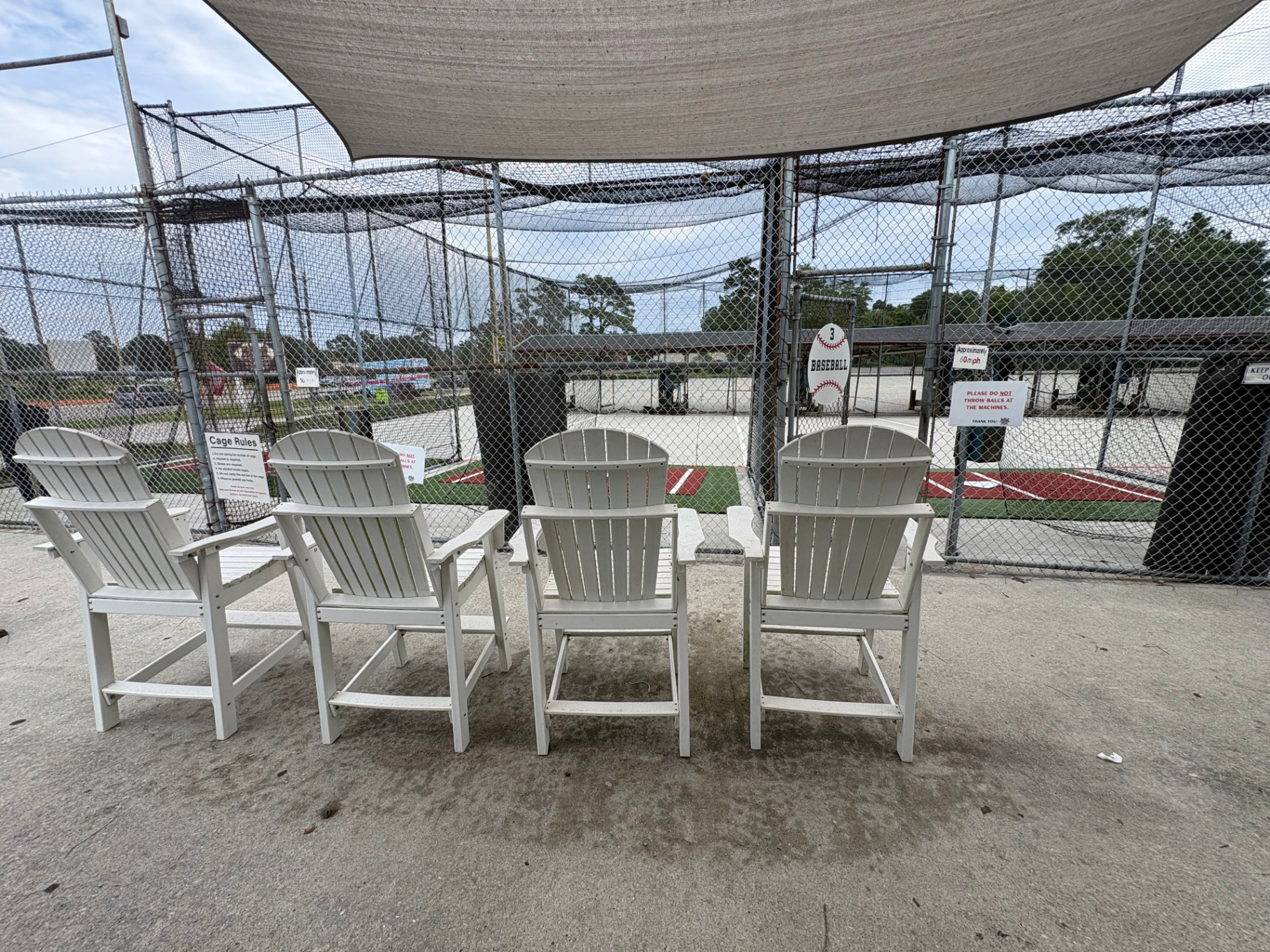 Adirondack chairs facing the cages