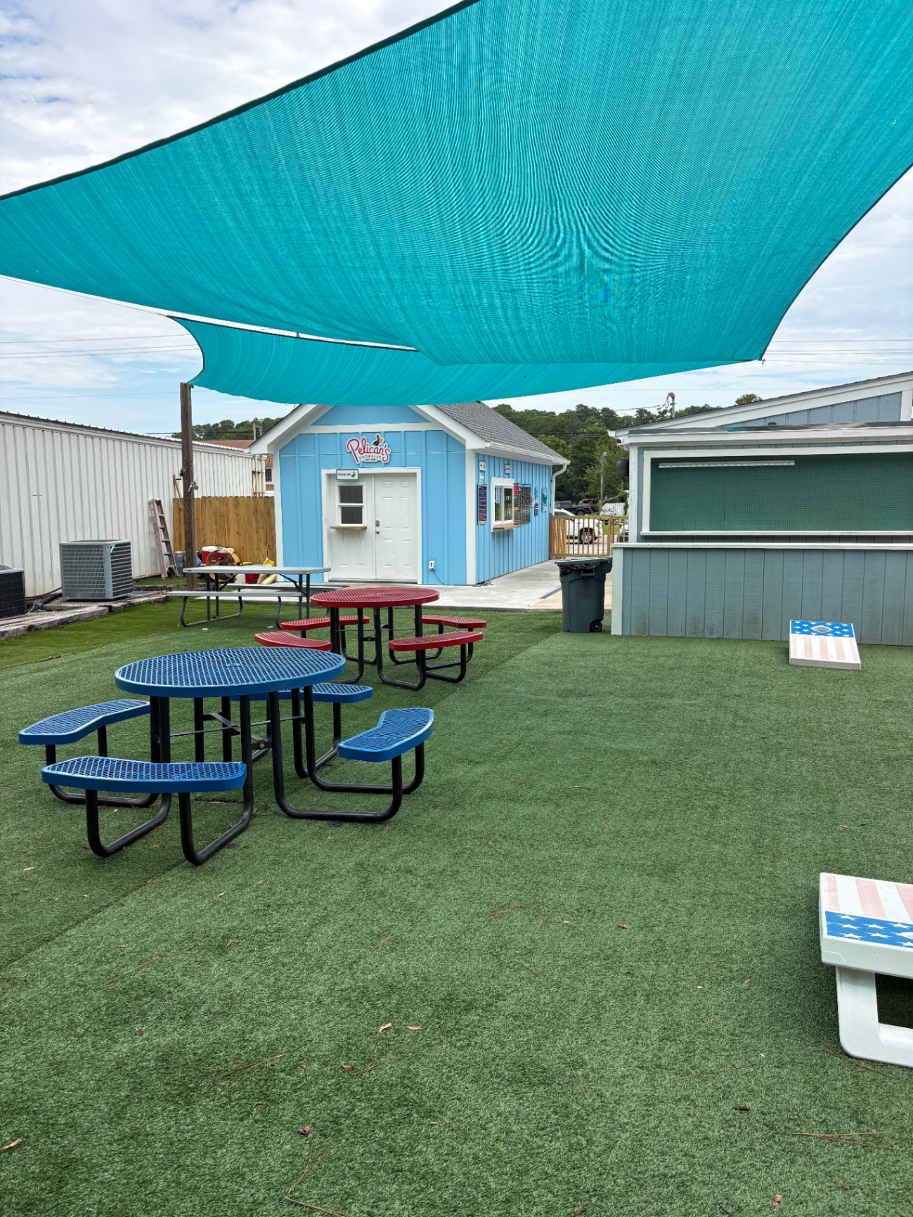 Shaded picnic tables in the garden